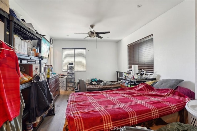 bedroom featuring ceiling fan and hardwood / wood-style flooring