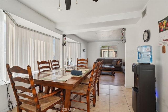 dining space featuring light tile patterned floors