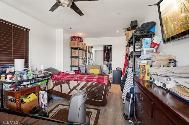 interior space with ceiling fan and light hardwood / wood-style floors