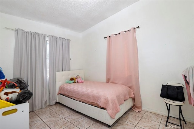 bedroom featuring a textured ceiling