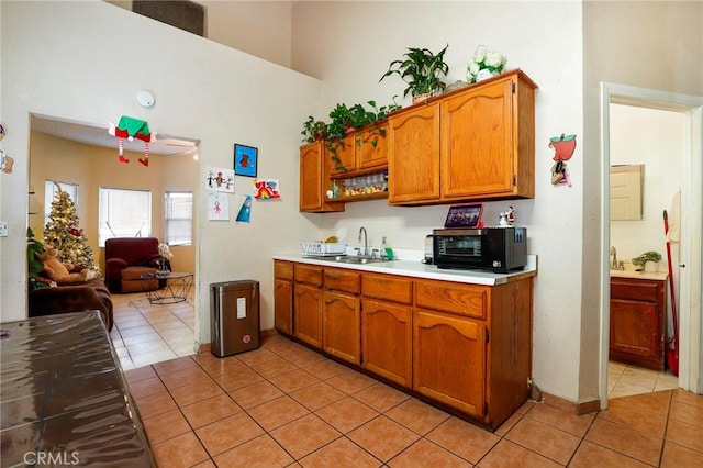 kitchen with light tile patterned floors and sink