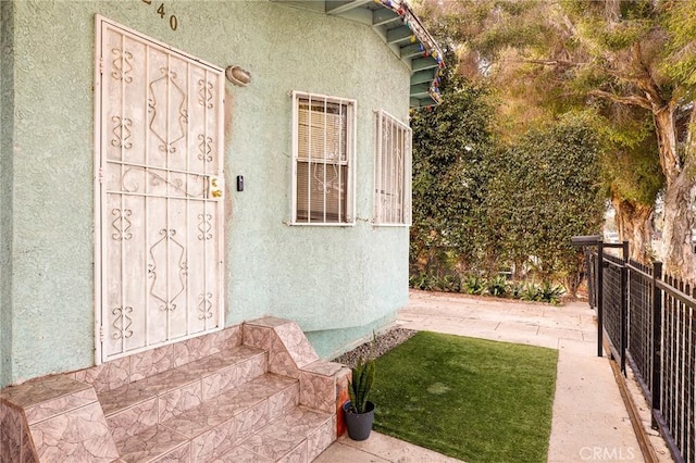 doorway to property featuring a patio area