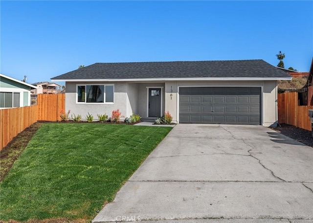 ranch-style house featuring a garage and a front lawn