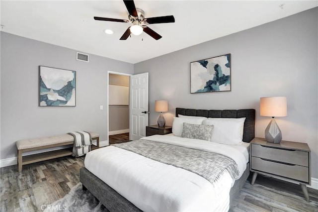 bedroom with ceiling fan and wood-type flooring