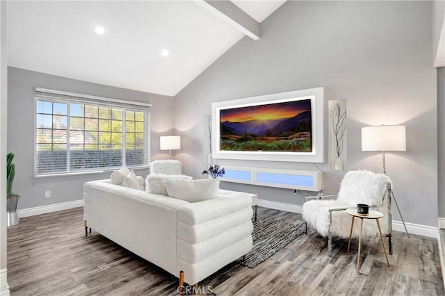 living room with high vaulted ceiling, beamed ceiling, and hardwood / wood-style floors