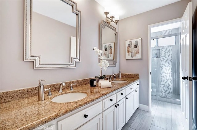 bathroom featuring an enclosed shower and vanity