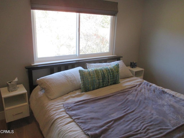 bedroom with multiple windows