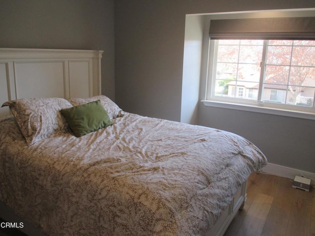 bedroom featuring hardwood / wood-style flooring