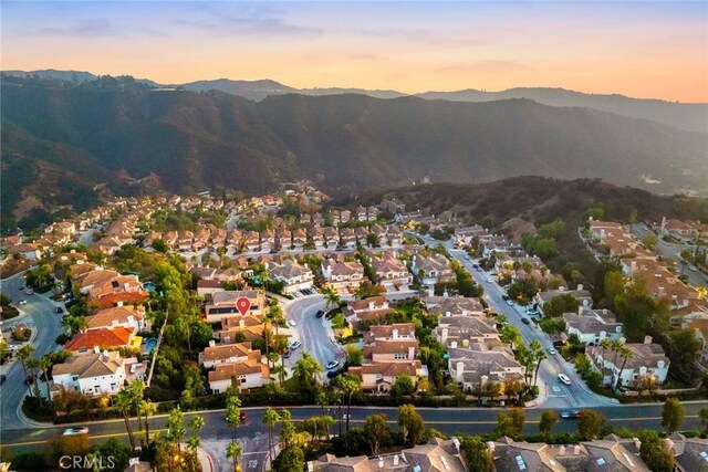 aerial view at dusk with a mountain view