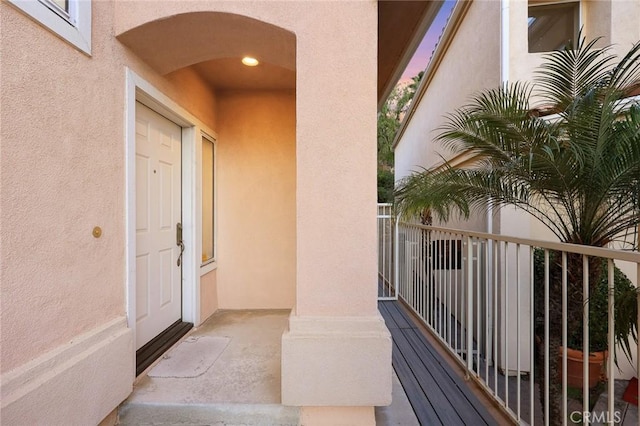 entrance to property featuring a balcony