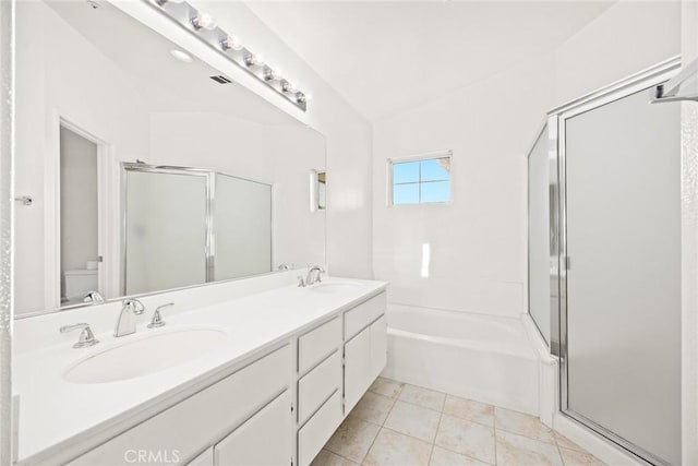 full bathroom featuring toilet, vanity, tile patterned floors, and plus walk in shower