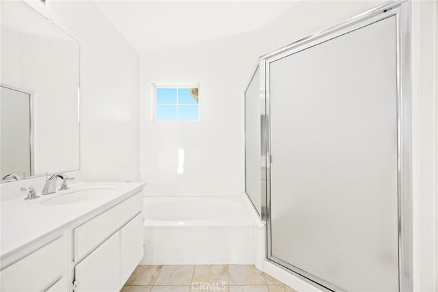 bathroom featuring shower with separate bathtub, vanity, and tile patterned flooring