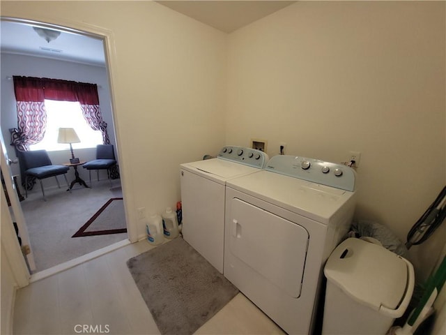 laundry room with washing machine and dryer