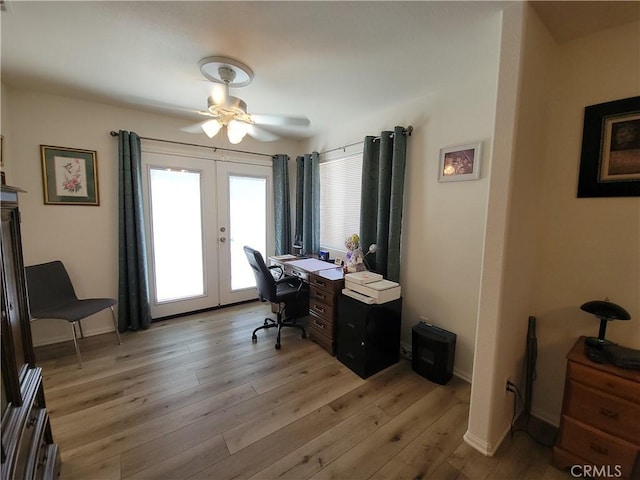 office area featuring ceiling fan, light hardwood / wood-style flooring, and french doors