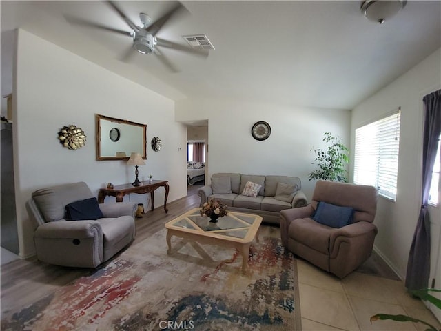 living room with ceiling fan and light hardwood / wood-style floors