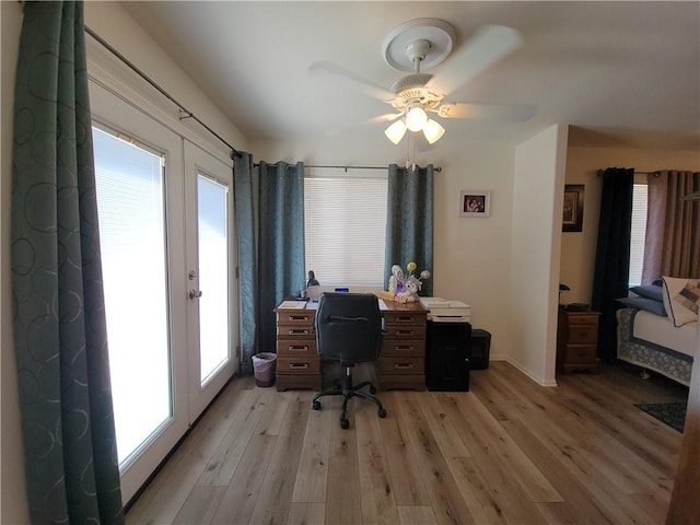 office area featuring ceiling fan, french doors, and light wood-type flooring