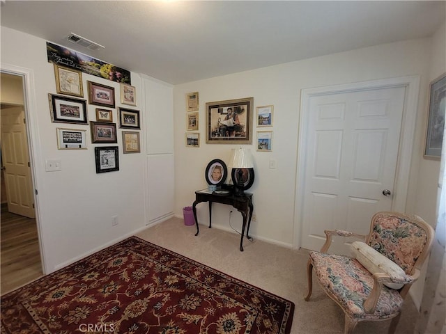 living area featuring carpet floors