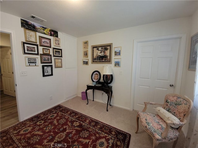 living area with carpet floors