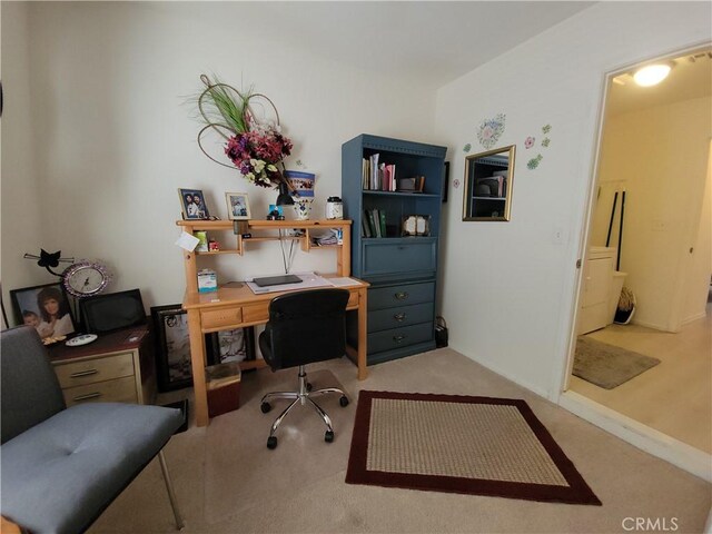 office area featuring light colored carpet