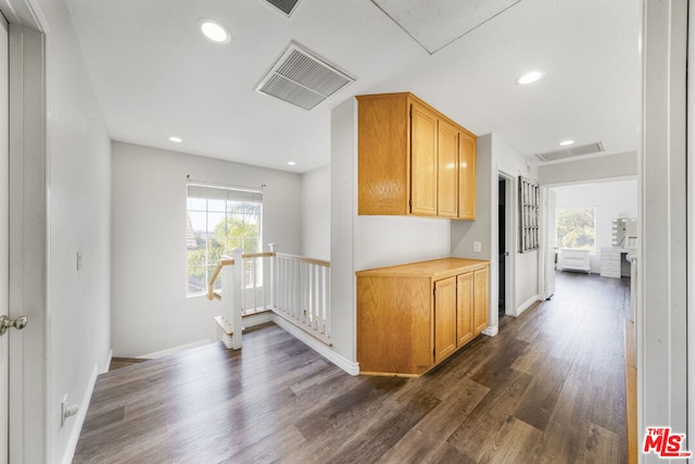 hall with dark hardwood / wood-style floors