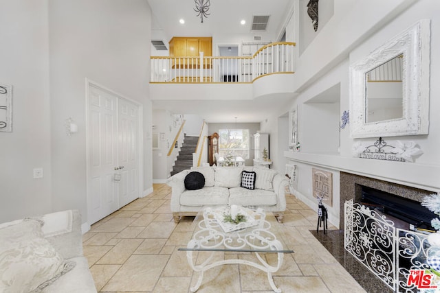 living room with a high ceiling