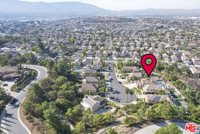 birds eye view of property featuring a mountain view