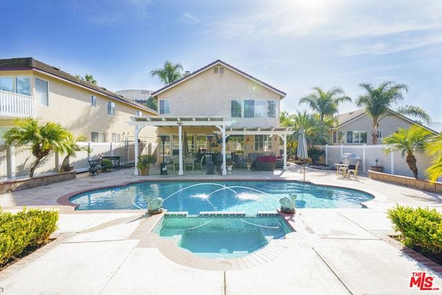 view of pool featuring an in ground hot tub, a patio, pool water feature, and a pergola