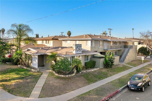 view of property with a balcony