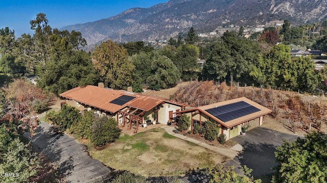 birds eye view of property with a mountain view