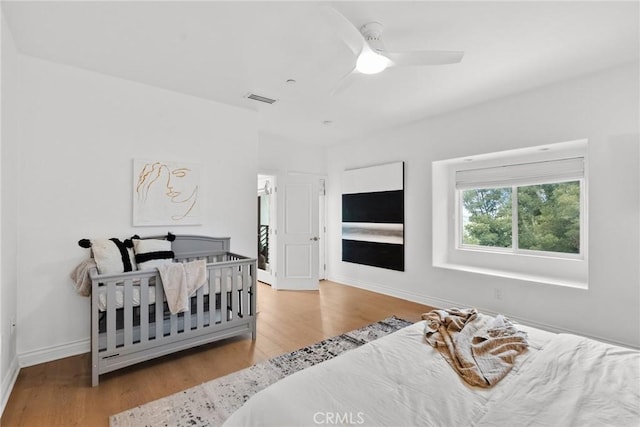 bedroom featuring ceiling fan and light hardwood / wood-style floors