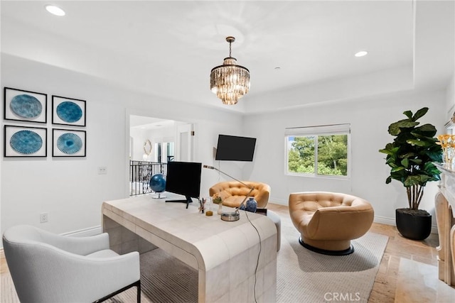 living room featuring a raised ceiling and an inviting chandelier