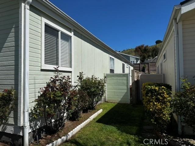 view of home's exterior featuring a lawn