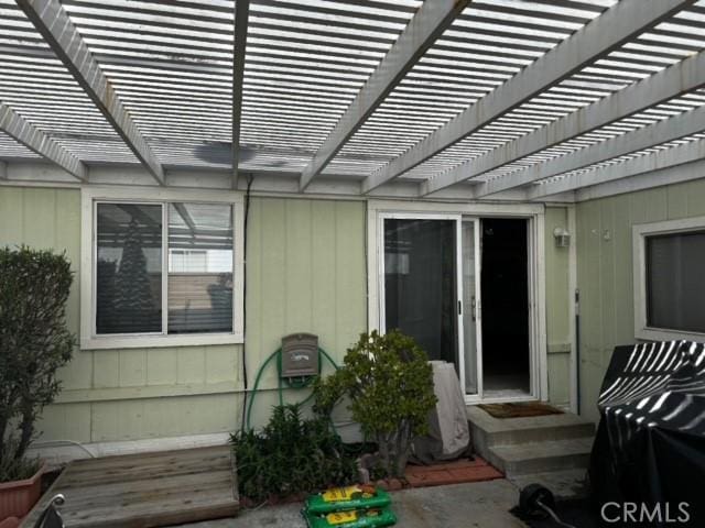 exterior space featuring a pergola and a patio