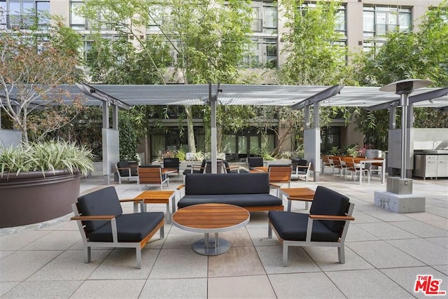 view of patio with outdoor lounge area and a pergola