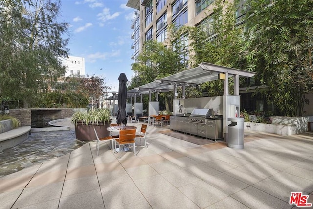 view of patio with exterior kitchen and area for grilling