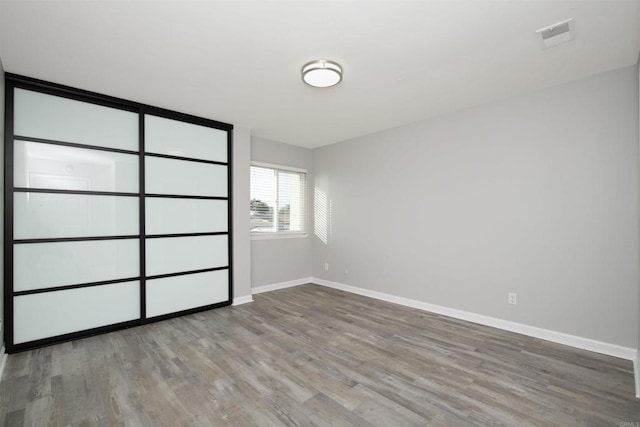 unfurnished bedroom with light hardwood / wood-style flooring