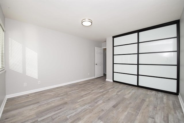 unfurnished bedroom featuring light hardwood / wood-style flooring