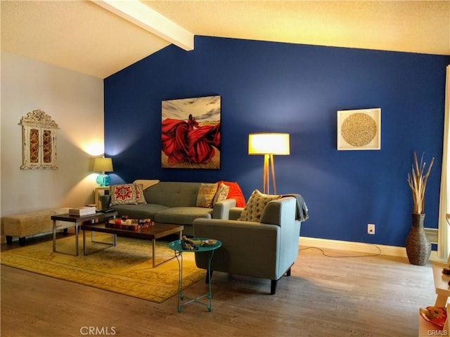 living room with lofted ceiling with beams and hardwood / wood-style flooring