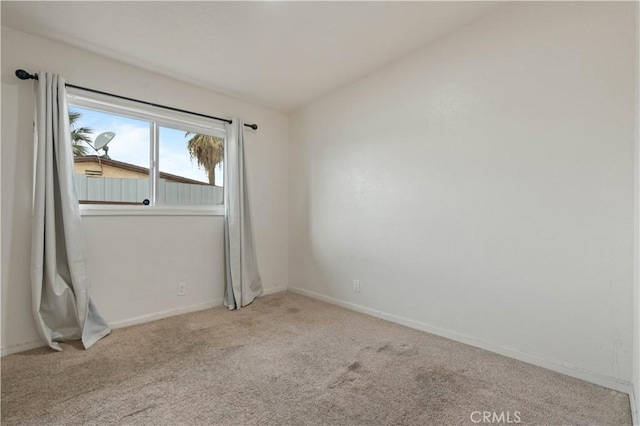 empty room with light colored carpet