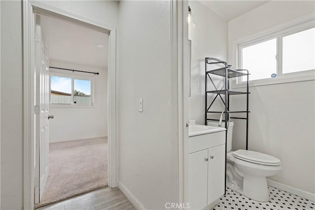 bathroom with toilet and vanity