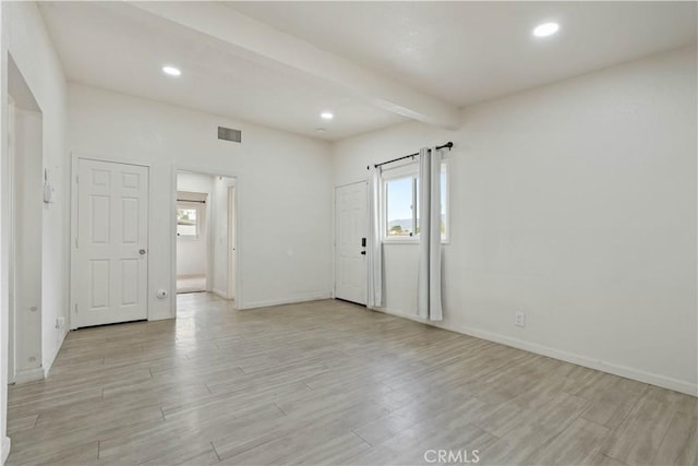 entrance foyer featuring beam ceiling