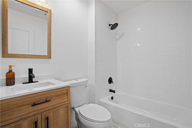 full bathroom featuring toilet, tiled shower / bath combo, and vanity