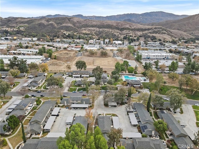 birds eye view of property with a mountain view