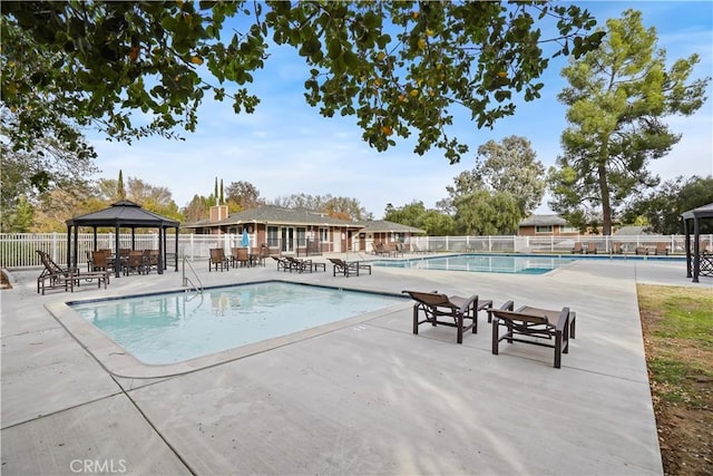 view of pool with a gazebo and a patio area