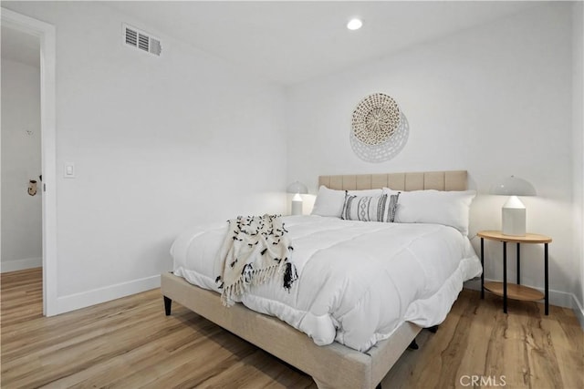 bedroom featuring hardwood / wood-style floors