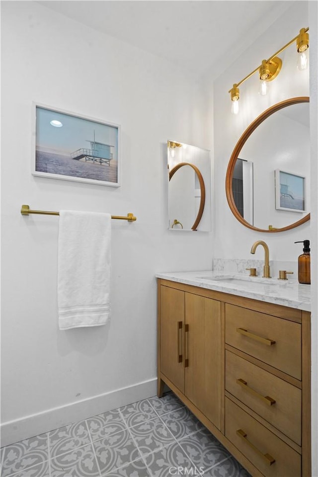 bathroom featuring tile patterned flooring and vanity