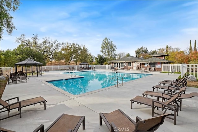 view of swimming pool featuring a gazebo and a patio