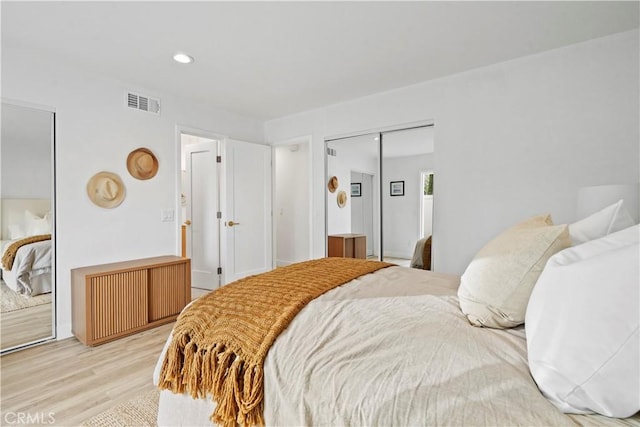 bedroom featuring a closet and light wood-type flooring