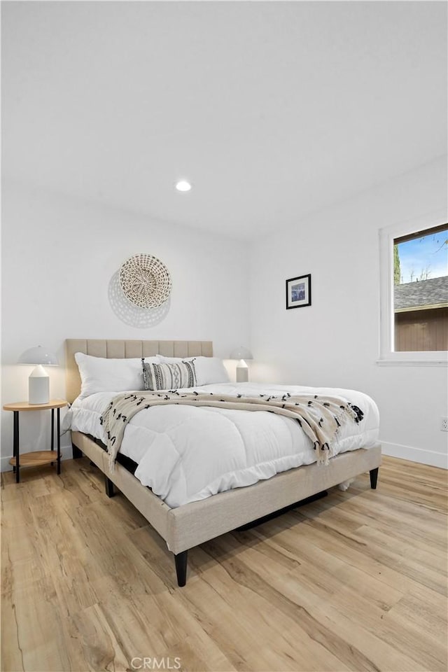 bedroom with light wood-type flooring