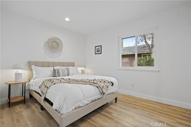 bedroom with light hardwood / wood-style flooring